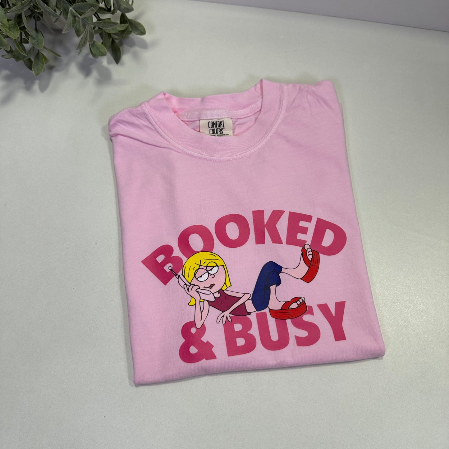 Pink lay down shirt with Lizzie McGuire lay down and booked and busy words