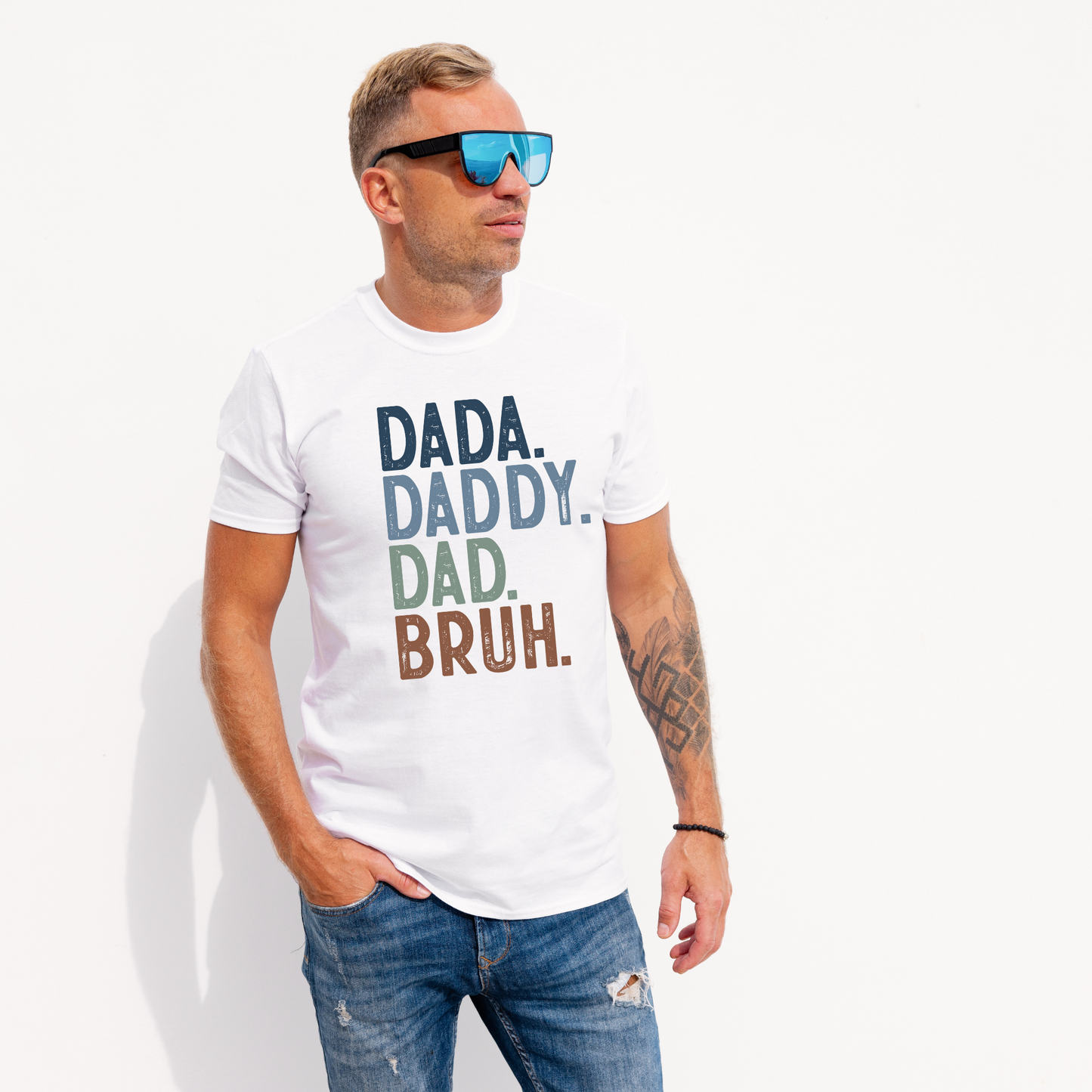a men wearing a white shirt that said dada daddy dad bruh