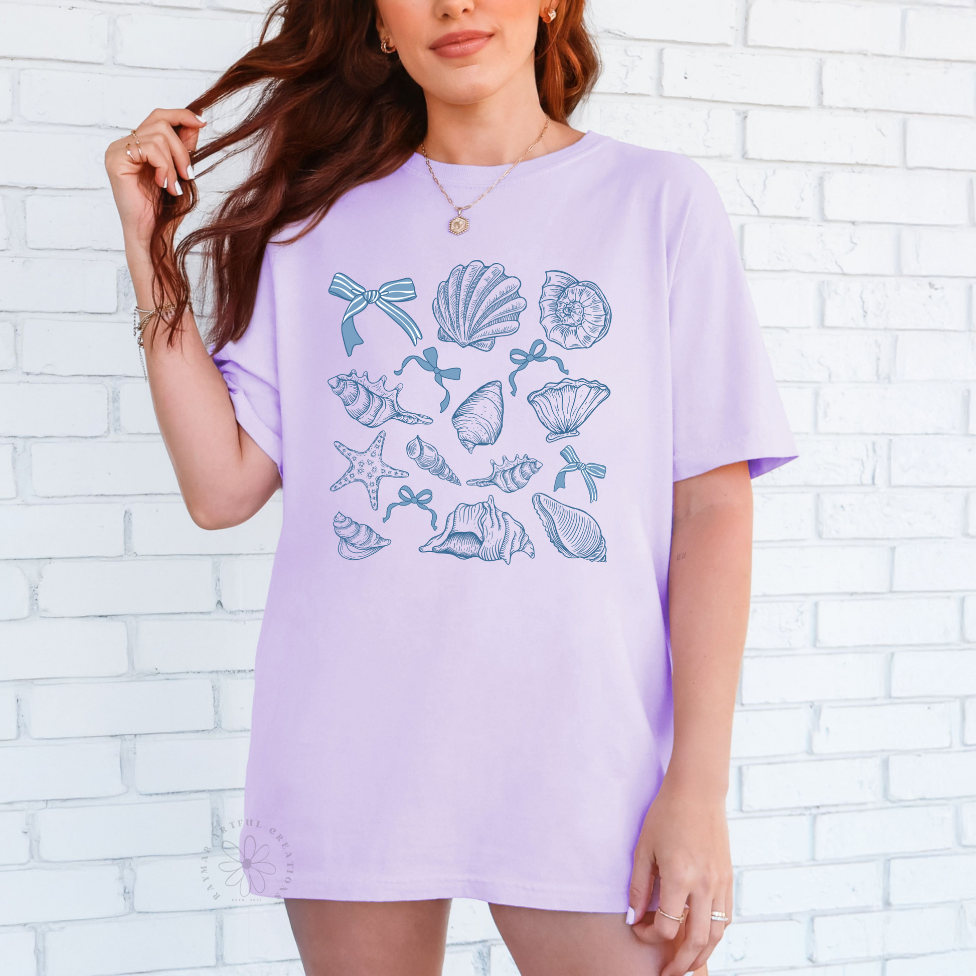 lavender shirt with a coquette seashell design in pastel blue color