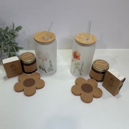 a pair of Flower cups with name, candle, flower coaster and a soap in a white background