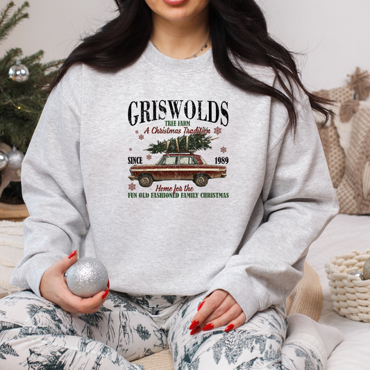 a women wearing an ash sweatshirt with a christmas vintage graphic design