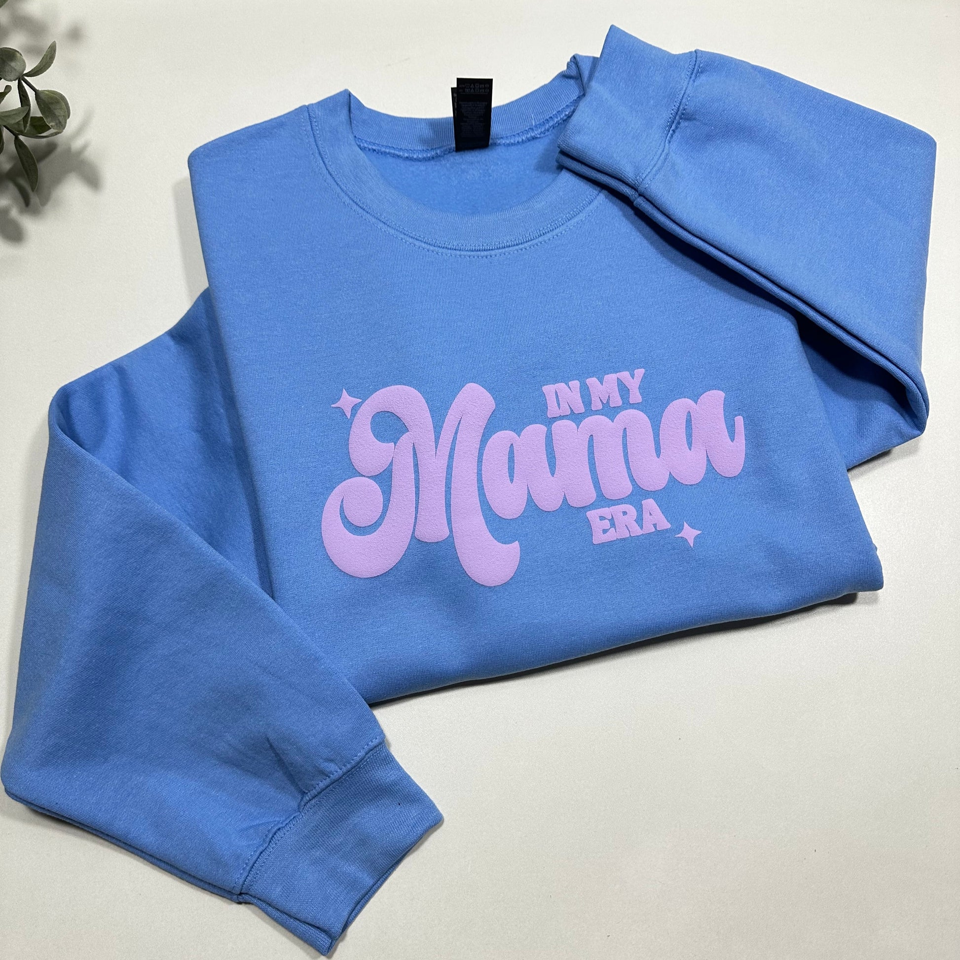 In my mama era Carolina blue sweatshirt with lilac puff design