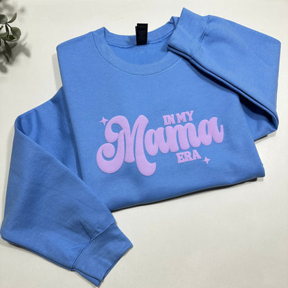 In my mama era Carolina blue sweatshirt with lilac puff design