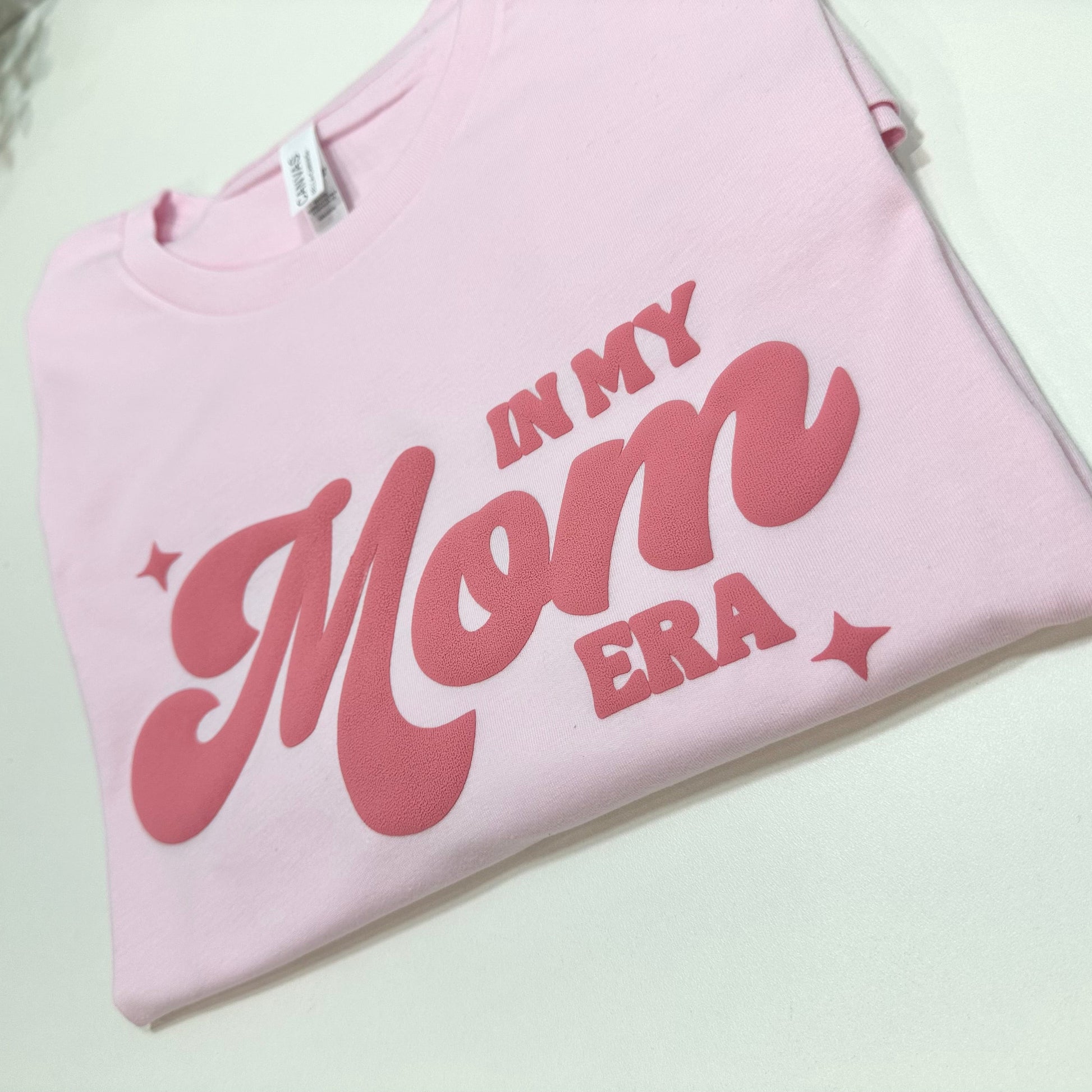 light pink shirt with in my mom era puff design in dark pink color