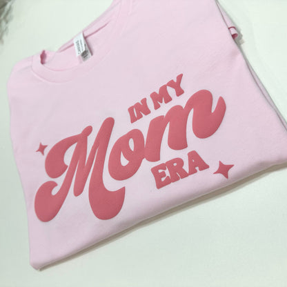 light pink shirt with in my mom era puff design in dark pink color