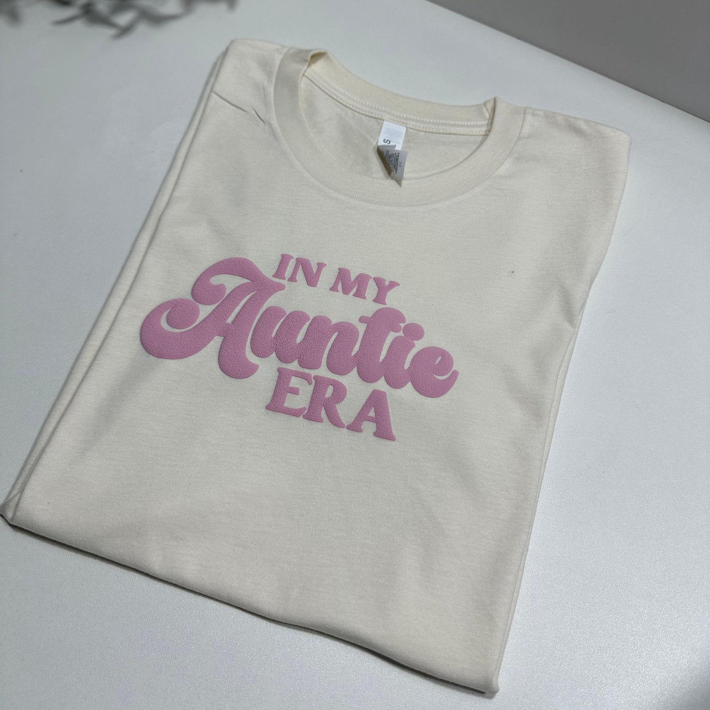 in my auntie era puff pink design on a natural color shirt