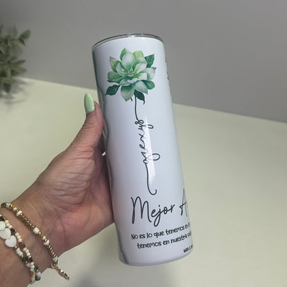a hand holding a custom tumbler with mejor amigas design