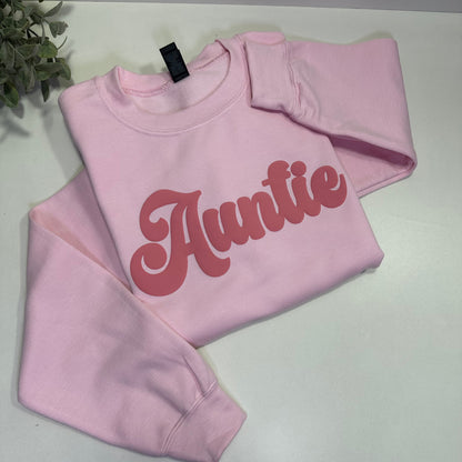 Light Pink sweatshirt s with 'Auntie' Pink text on a white background