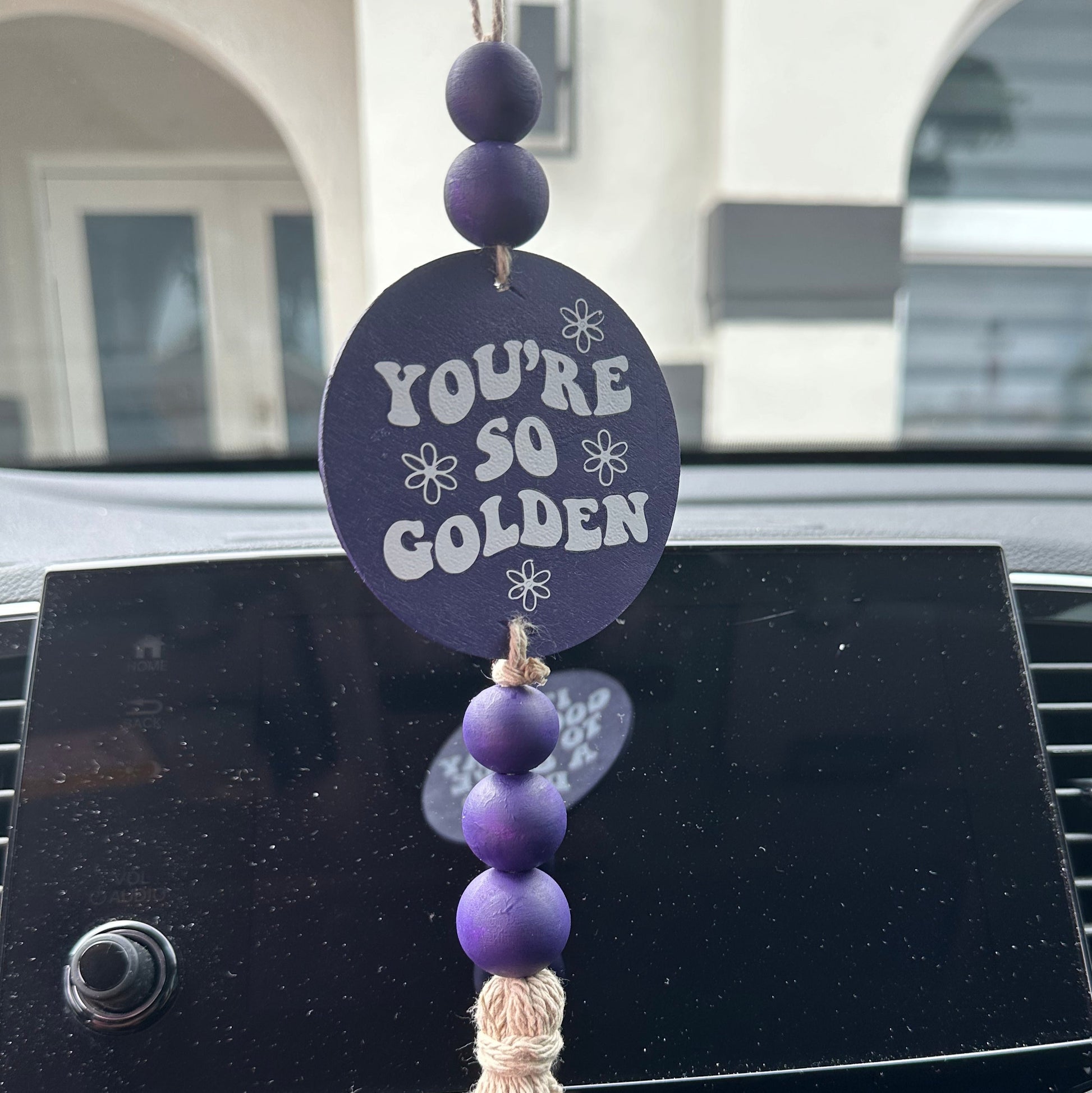 Car Mirror Hanging in purple that said you are so golden